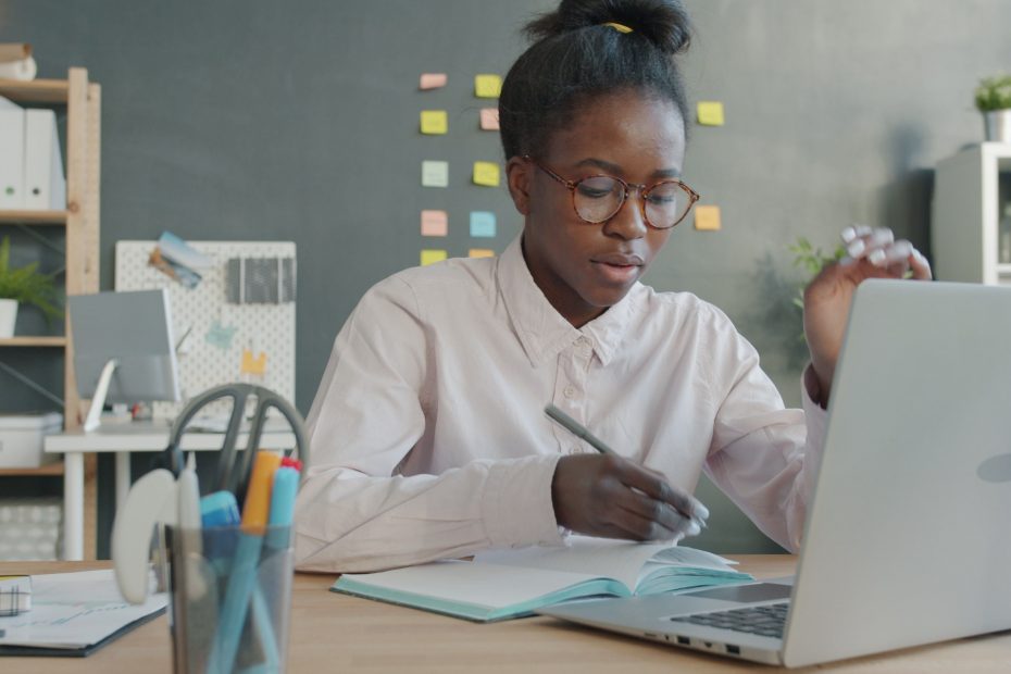 Young adult studying using a laptop