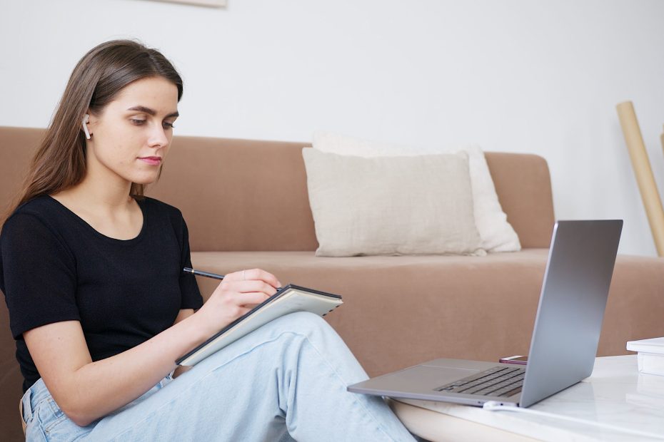 Young adult studying with a laptop